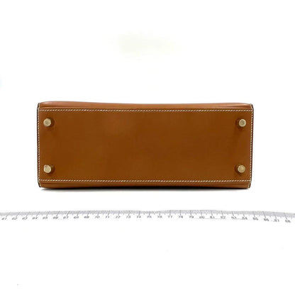 HERMES KELLY 25 | FAUVE SMOOTH BARENIA GHW